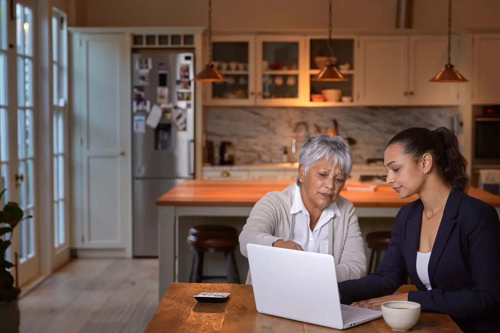 A woman sitting with an attorney.